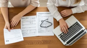 Pensioners reviewing winter heating costs and energy bills at home