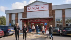 Matalan employees and shoppers outside a Carlisle retail park following the store relocation